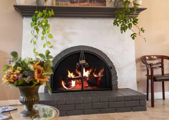 a view of a dining room with furniture and a chandelier
