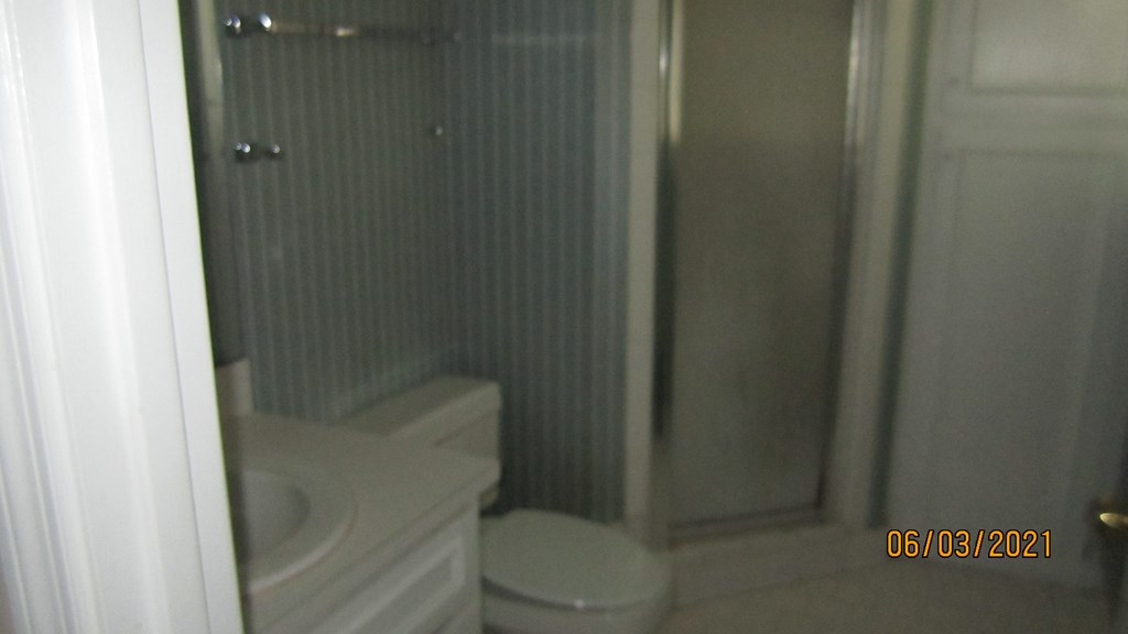 2250 15th Street, Unit 8 Columbus, GA 31906 - Photo 10 of 14 a bathroom with a toilet and a shower