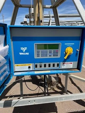 a table chair in a room next to a window