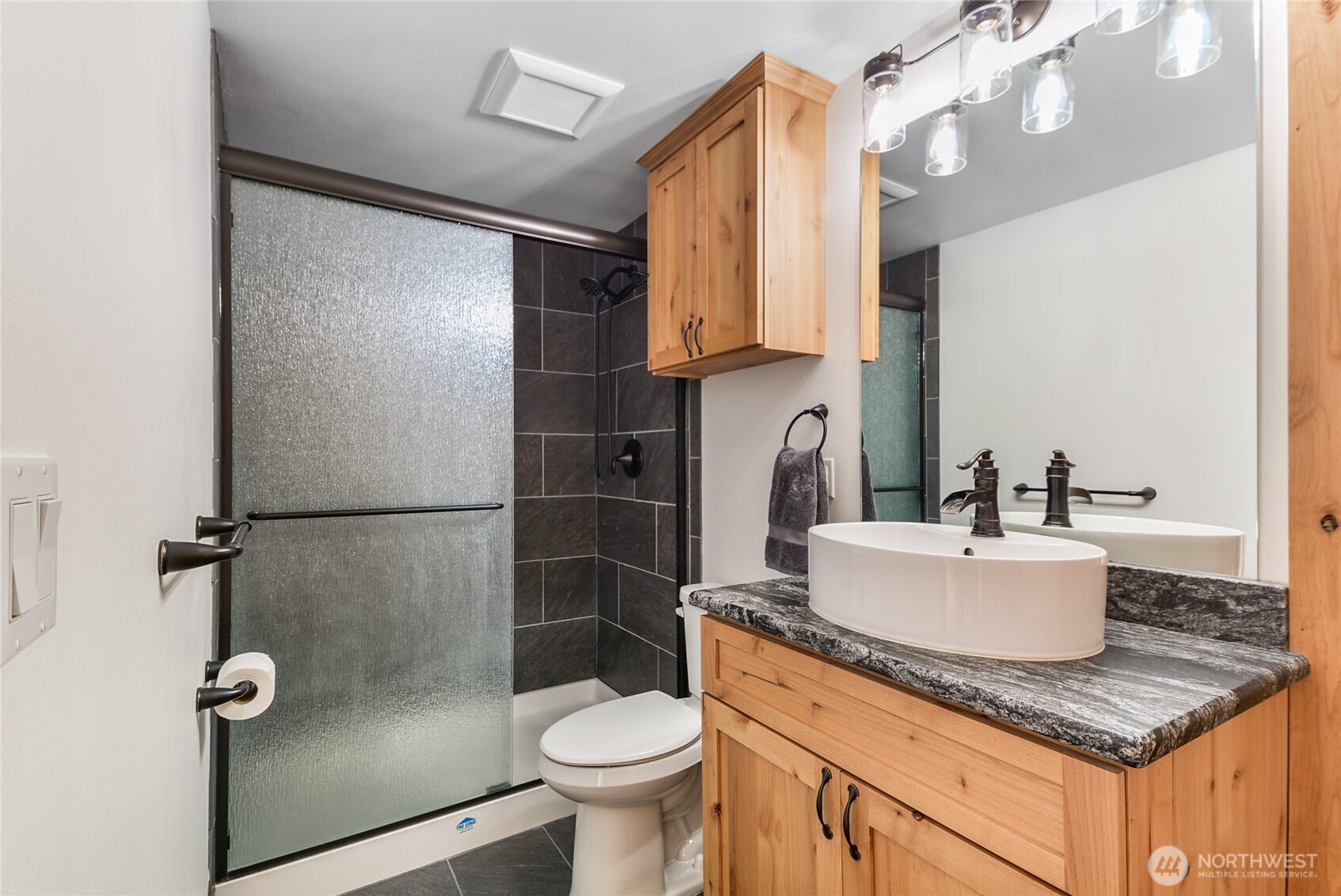30313 State Rte 530 Northeast Arlington, WA 98223 - Photo 14 of 35 a bathroom with a sink a toilet and shower