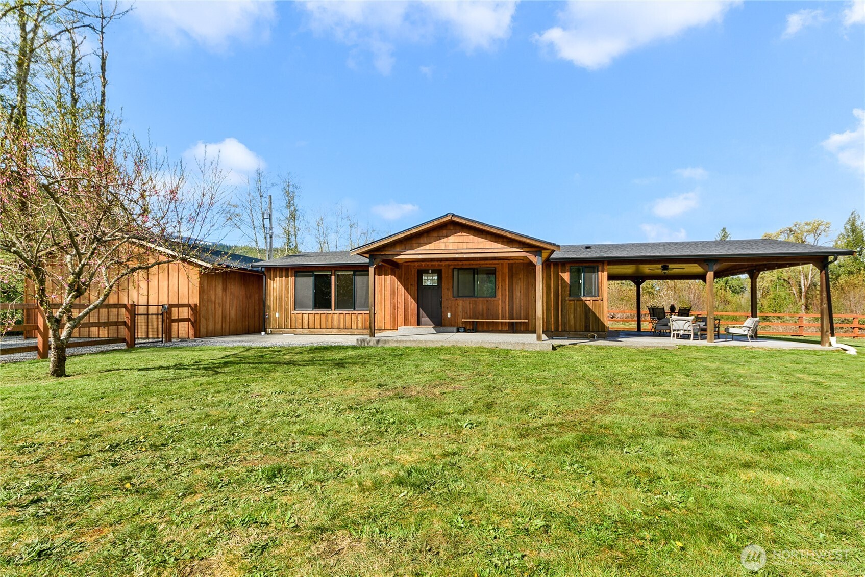 30313 State Rte 530 Northeast Arlington, WA 98223 - Photo 2 of 35 a front view of a house with a garden