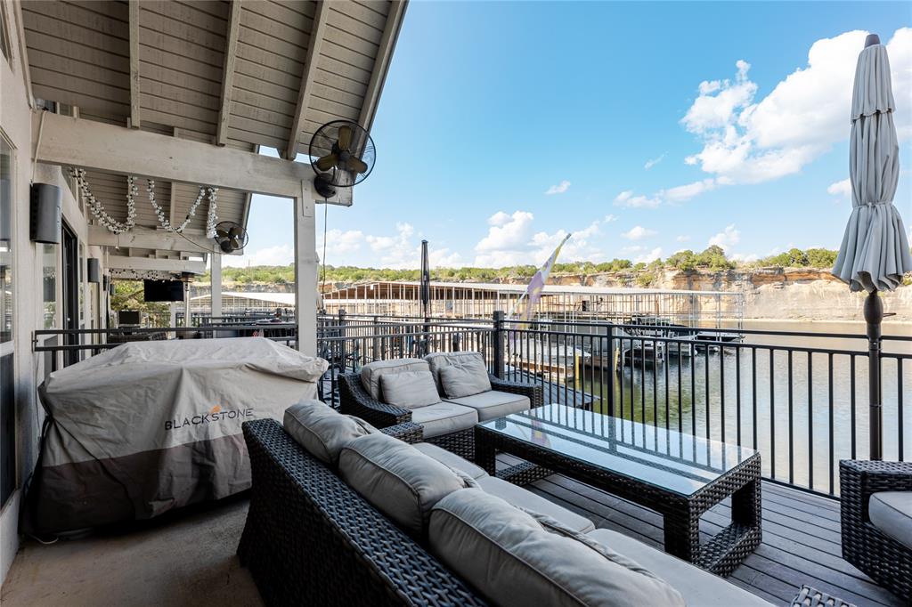 3005 Upcreek Alley, Unit 4 Strawn, TX 76475 - Photo 14 of 29 a view of a roof deck with couches