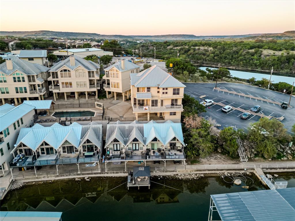 3005 Upcreek Alley, Unit 4 Strawn, TX 76475 - Photo 24 of 29 an aerial view of a house with yard swimming pool and ocean view