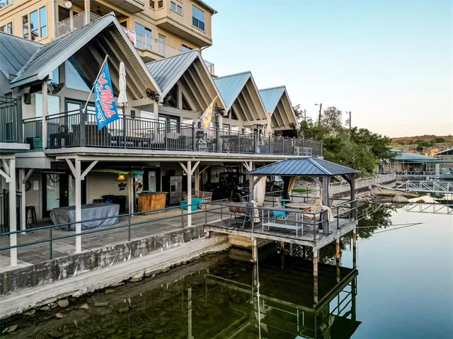 a view of house with outdoor space and sitting area