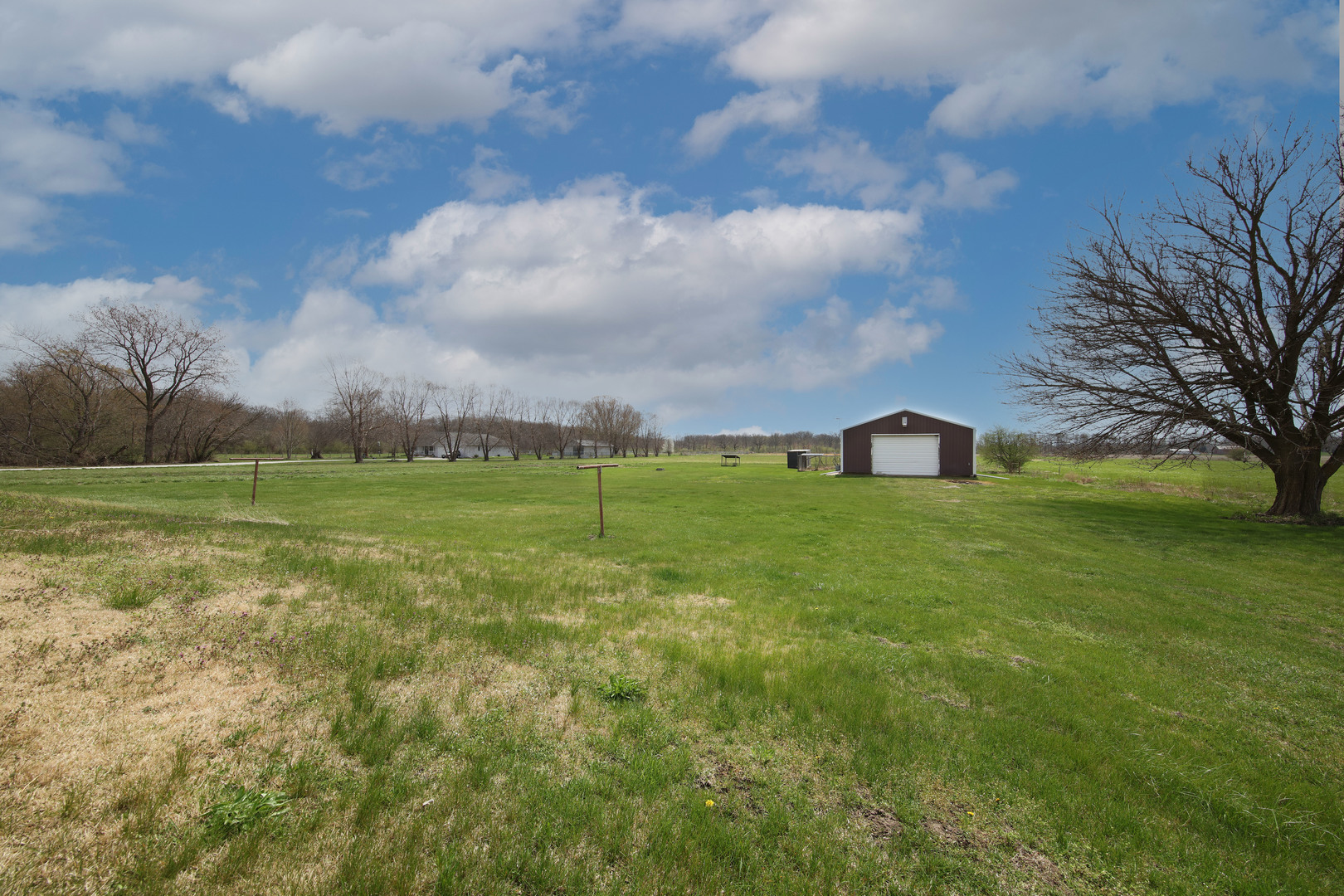 23525 Widows Road Wilmington, IL 60481 - Photo 17 of 17 a view of a field with an trees in the background