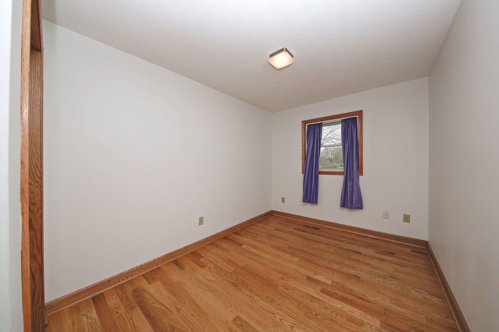 23525 Widows Road Wilmington, IL 60481 - Photo 5 of 17 an empty room with windows