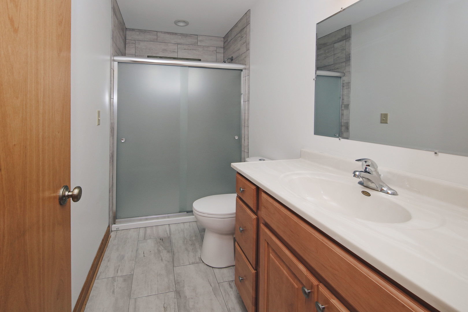 23525 Widows Road Wilmington, IL 60481 - Photo 8 of 17 a bathroom with a sink a toilet and shower