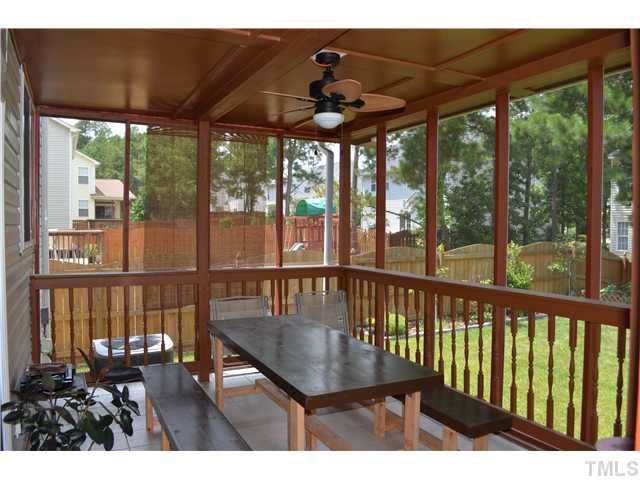 5853 Parkchester Road Raleigh, NC 27616 - Photo 14 of 19 a view of a balcony with furniture and wooden floor