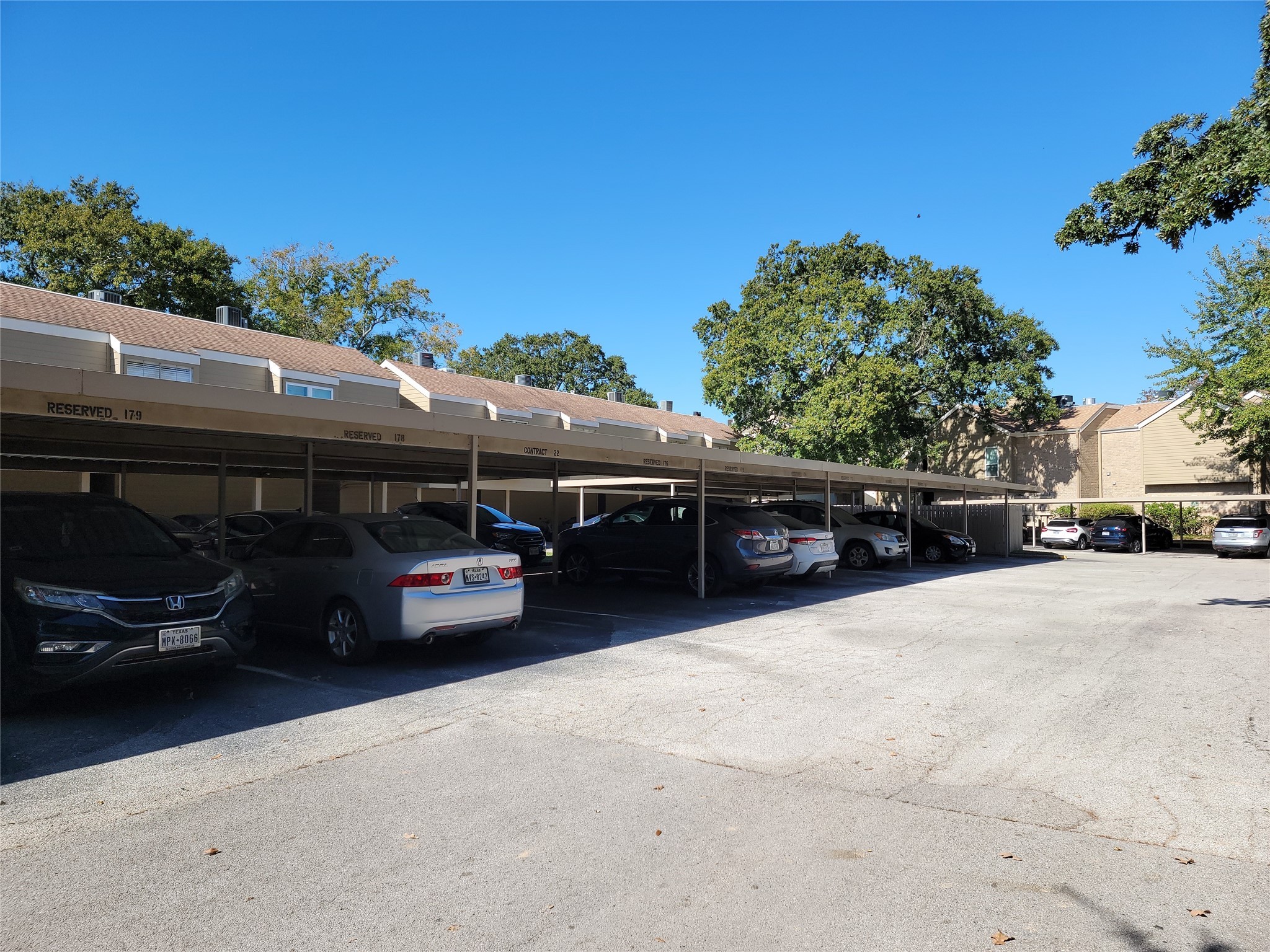 2100 Tanglewilde Street, Unit 600 Houston, TX 77063 - Photo 19 of 21 a car parked in front of a house