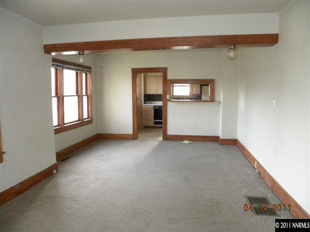 845 Wheeler Avenue Reno, NV 89502 - Photo 2 of 8 an empty room with windows and cabinet
