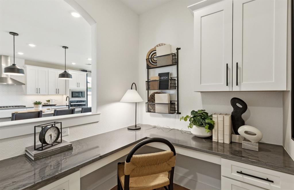 11129 Carham Street Haslet, TX 76052 - Photo 6 of 19 a kitchen with a sink and cabinets