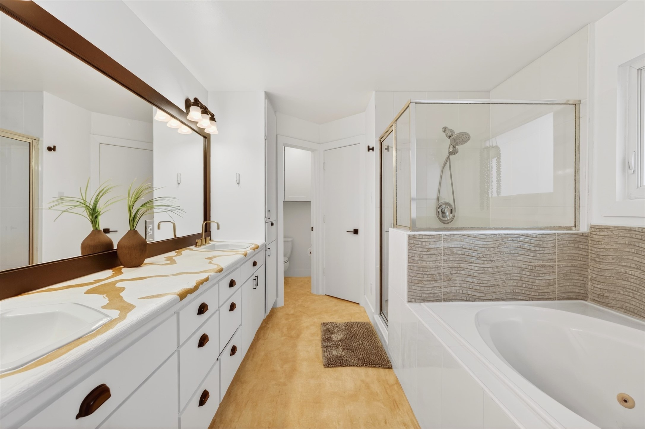 2716 Bagby Street Houston, TX 77006 - Photo 17 of 29 a bathroom with a tub sink and mirror