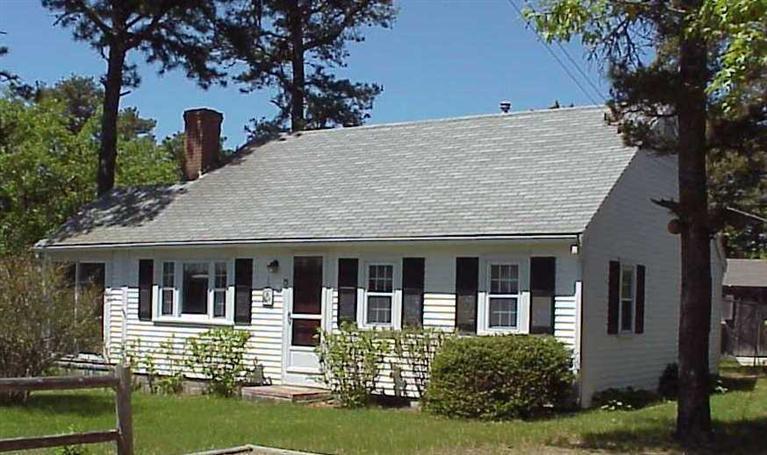 13 Beaten Road Dennis Port, MA 02639 - Photo 1 of 7 a front view of a house with a yard