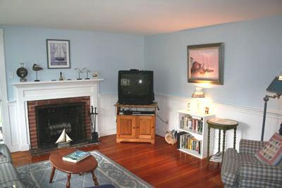 13 Beaten Road Dennis Port, MA 02639 - Photo 3 of 7 a living room with furniture and a fireplace