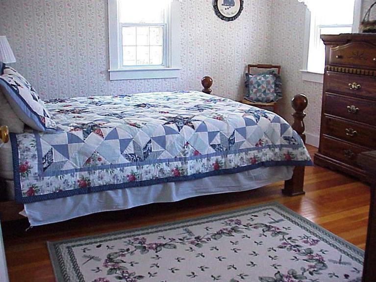 13 Beaten Road Dennis Port, MA 02639 - Photo 7 of 7 a bed sitting in a bedroom next to a window