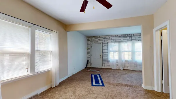 a view of an empty room and window