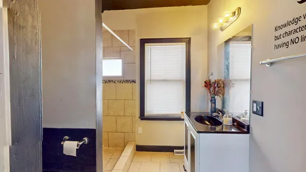 a bathroom with a sink and a mirror