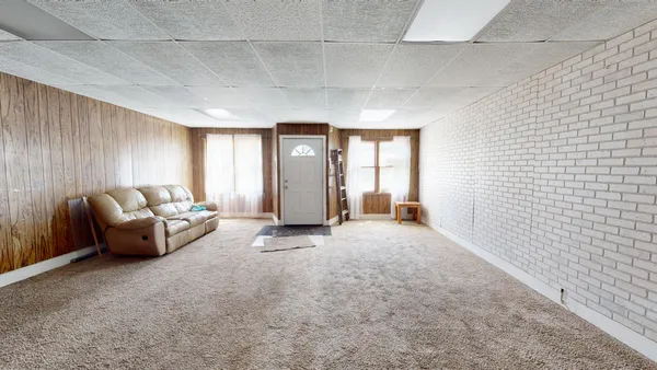 a view of livingroom with furniture and window