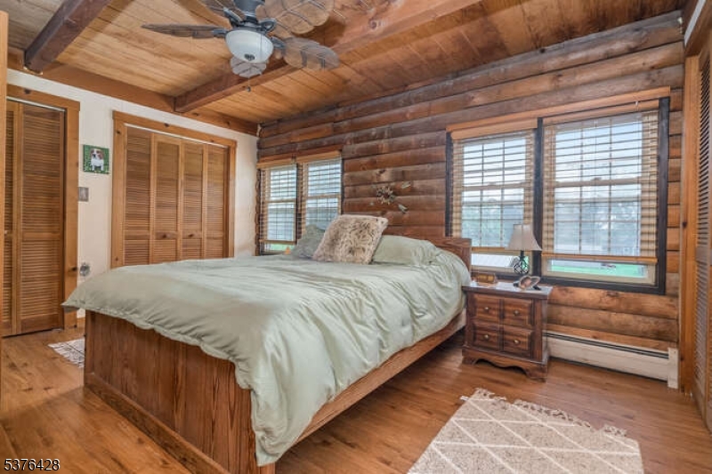 153 Hammar Road Frenchtown, NJ 08825 - Photo 15 of 24 a bedroom with a balcony a bed and a large window