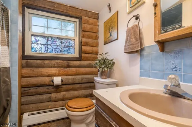 a bathroom with a sink and toilet