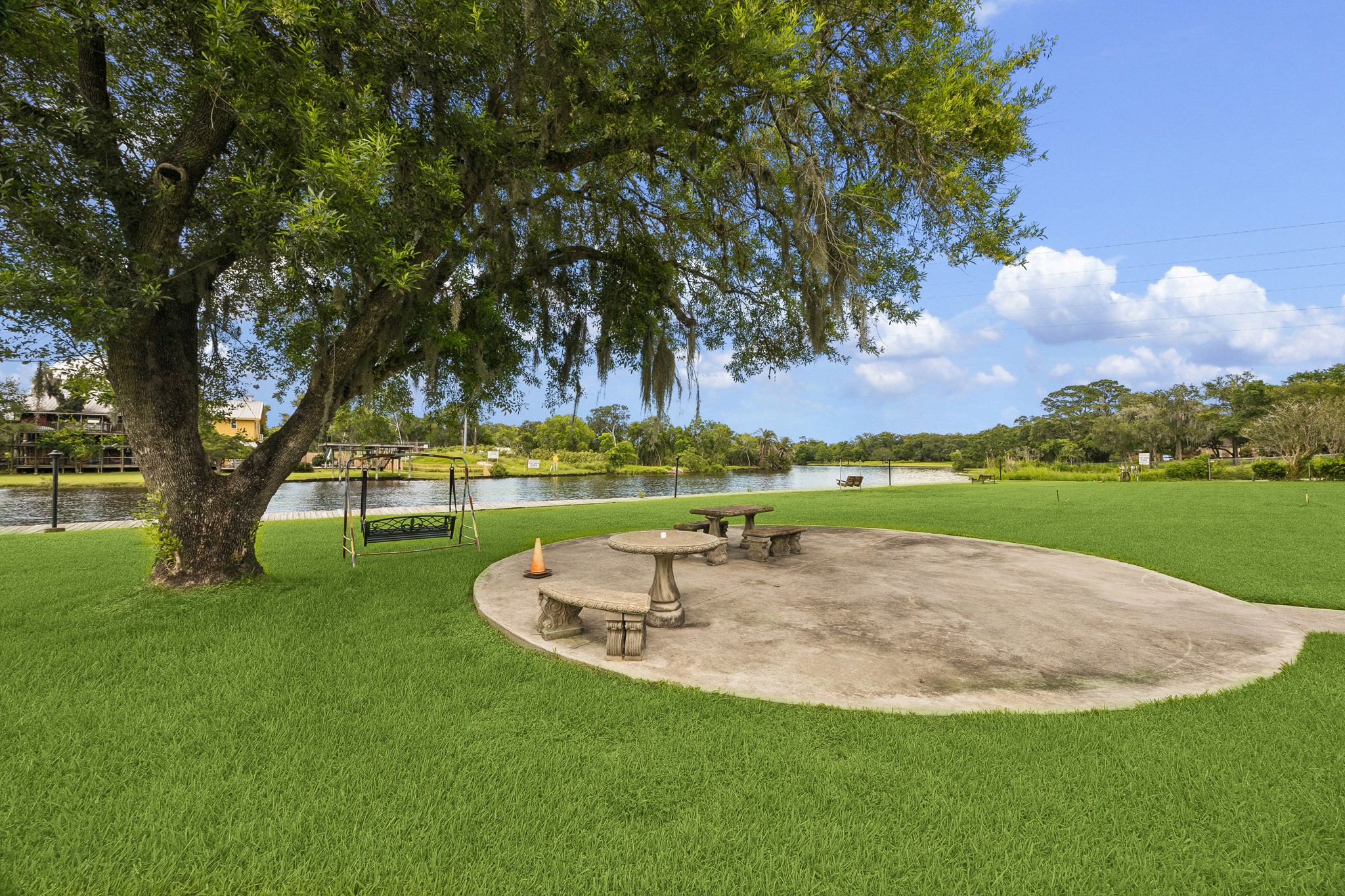2102 Casa Rio Circle Dickinson, TX 77539 - Photo 18 of 22 Waterfront living extends just beyond your front door!!! The community overlooks the Dickinson Bayou and features a private, community only boardwalk, shaded seating areas, park benches, & sweeping water views framed by mature oak trees. A perfect setting for morning coffee, evening sunsets, fishing, or gathering with neighbors while enjoying the tranquility of the bayou. ***Bonus ~ All community amenities & common areas are covered by your HOA fees ~ No additional fees!!!! Home did not flood in Harvey!!