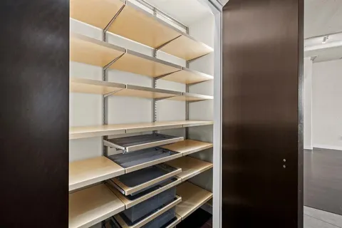 a view of room with racks on the wall