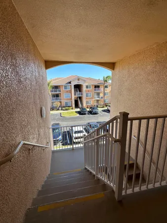 a view of a balcony with furniture