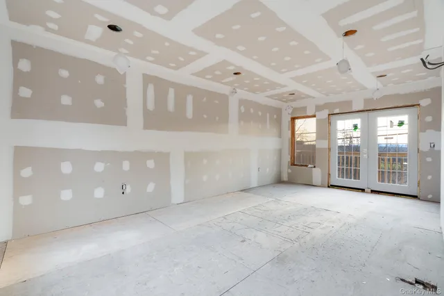 a view of a wooden deck besides a yard