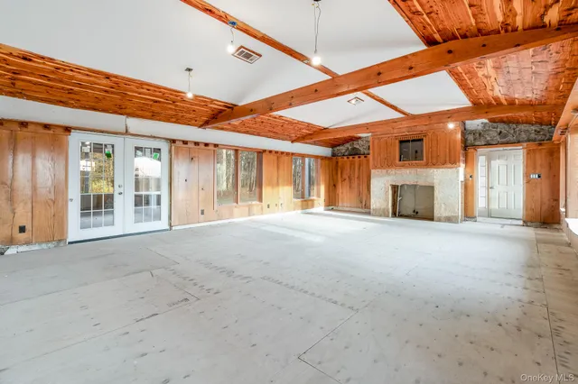 a view of a room with a large window