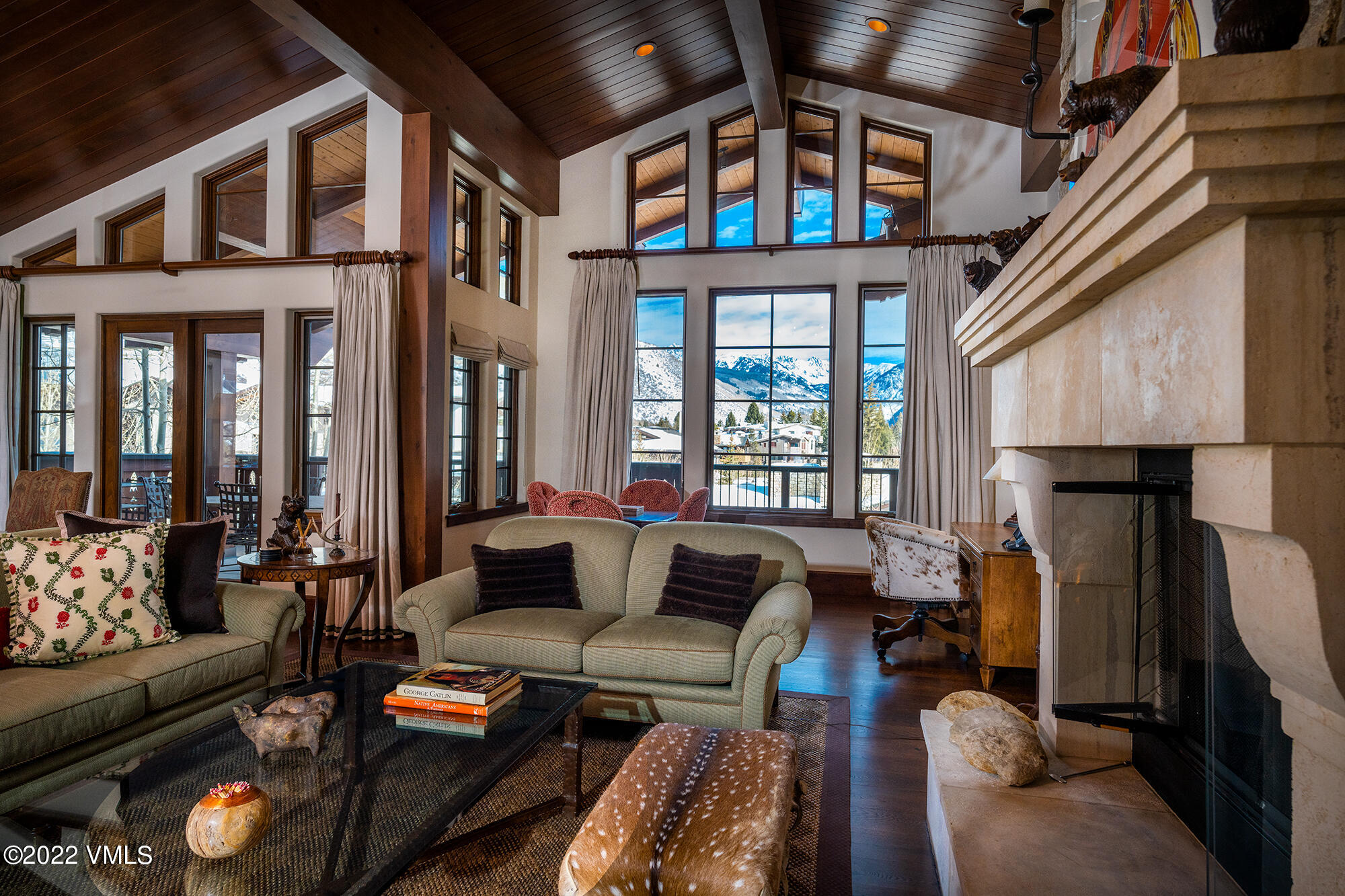 a living room with furniture fireplace and a window
