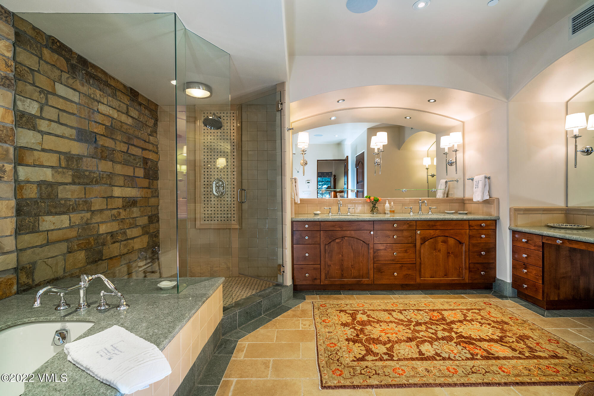 151 Vail Road, Unit 12 Vail, CO 81657 - Photo 12 of 22 a bathroom with a sink a vanity a mirror and a bathtub