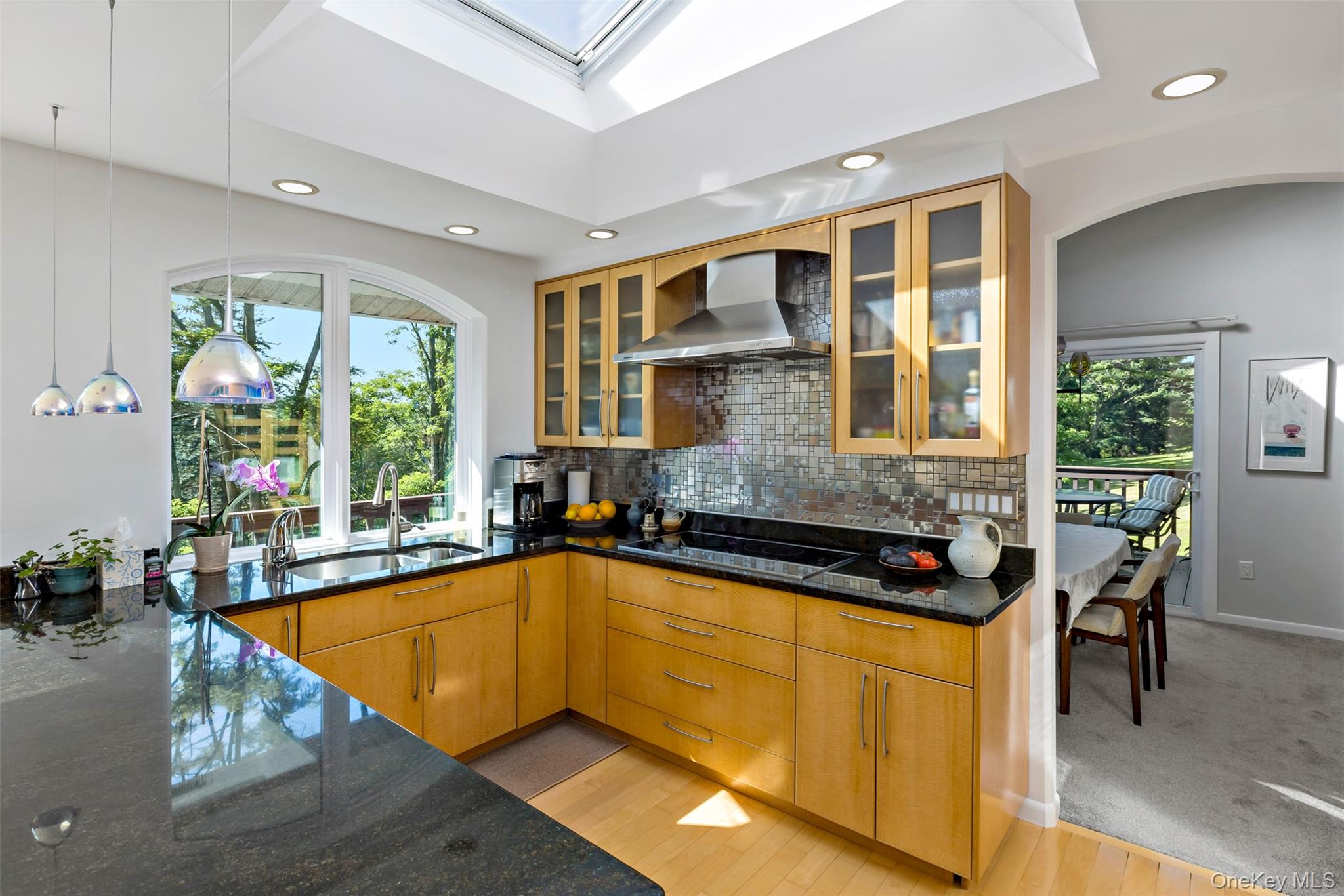 207 East Hook Road Hopewell Junction, NY 12533 - Photo 14 of 41 a view of a kitchen with a large window and dining table