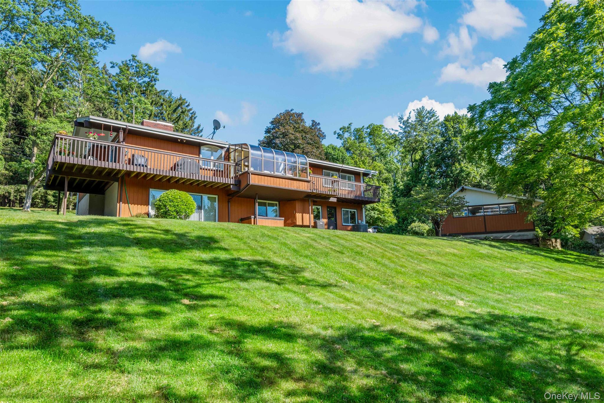207 East Hook Road Hopewell Junction, NY 12533 - Photo 33 of 41 a view of a house with a big yard potted plants and a large tree