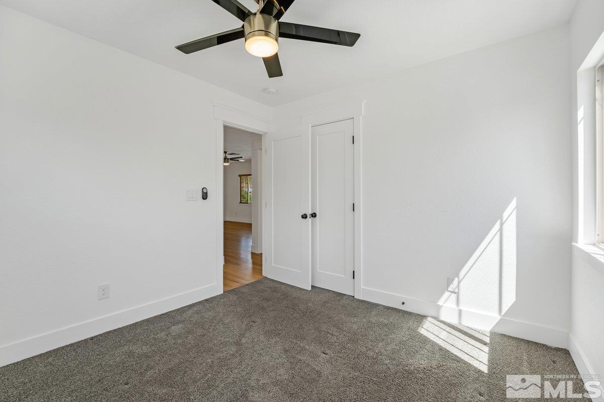441 I Street Sparks, NV 89431 - Photo 12 of 16 an empty room with a ceiling fan and window