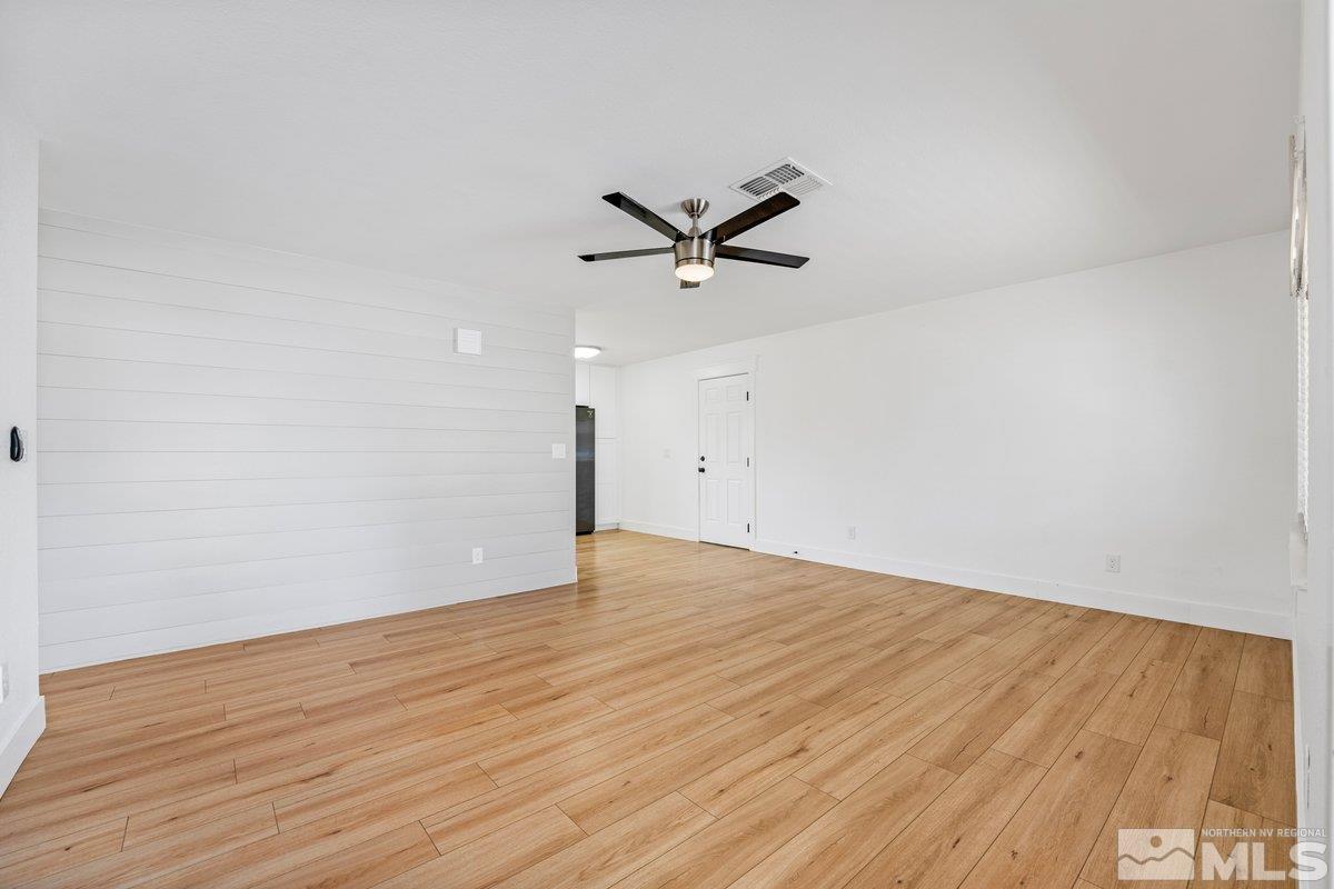 441 I Street Sparks, NV 89431 - Photo 6 of 16 a view of a room with wooden floor and a ceiling fan