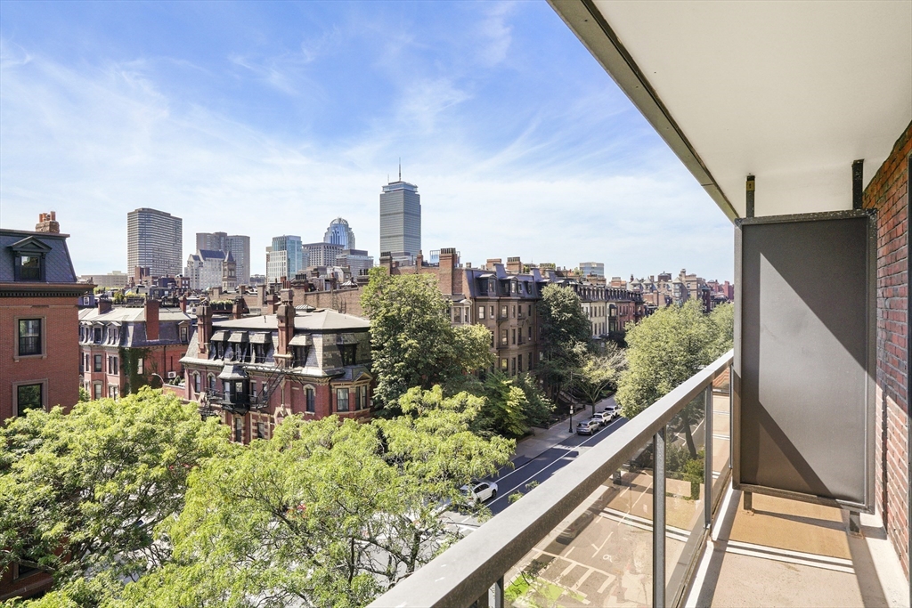 180 Beacon Street, Unit 6A Boston, MA 02116 - Photo 14 of 26 a view of a city from a balcony with outdoor seating
