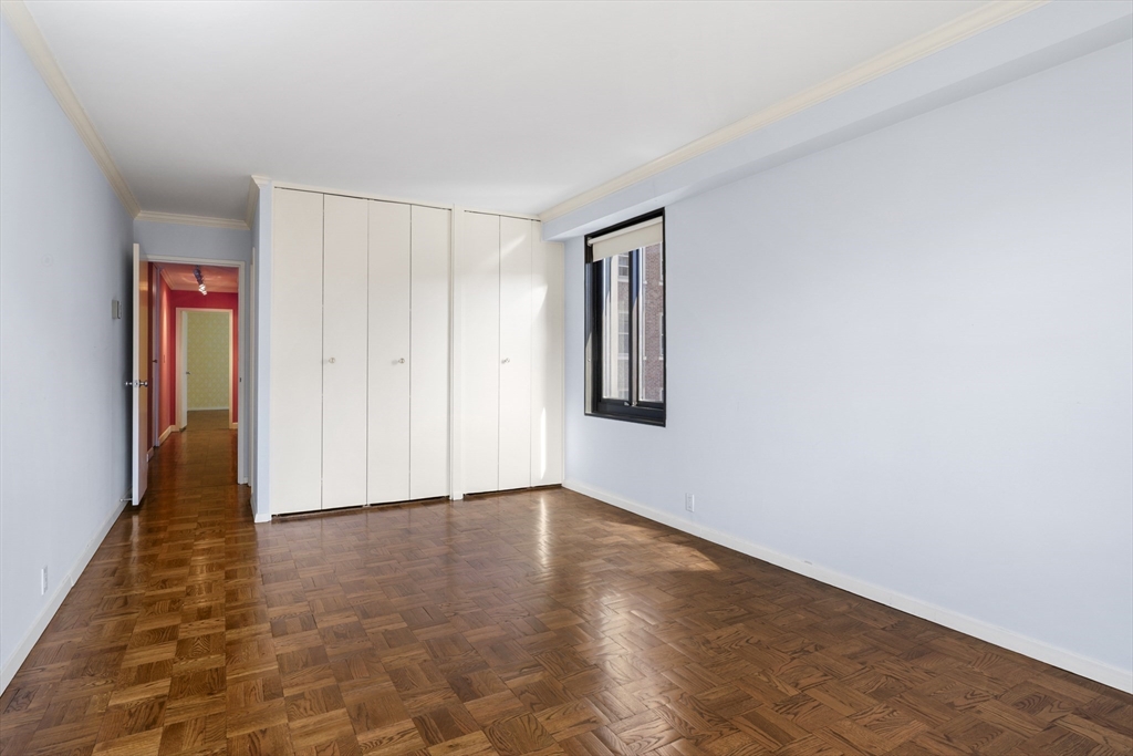 180 Beacon Street, Unit 6A Boston, MA 02116 - Photo 16 of 26 a view of an empty room with wooden floor