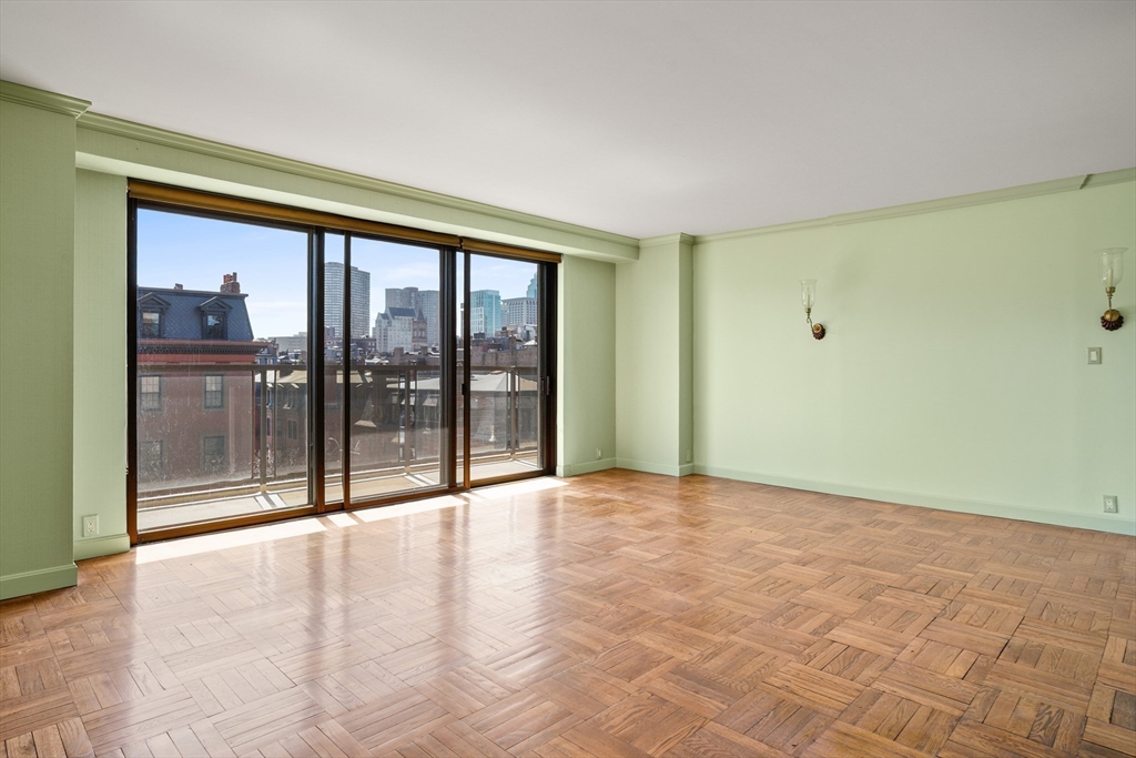 180 Beacon Street, Unit 6A Boston, MA 02116 - Photo 4 of 26 a view of an empty room with glass door