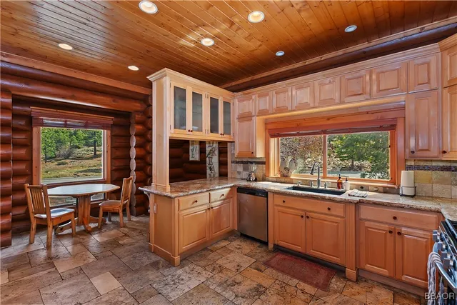 a open kitchen that has a sink and a stove in it