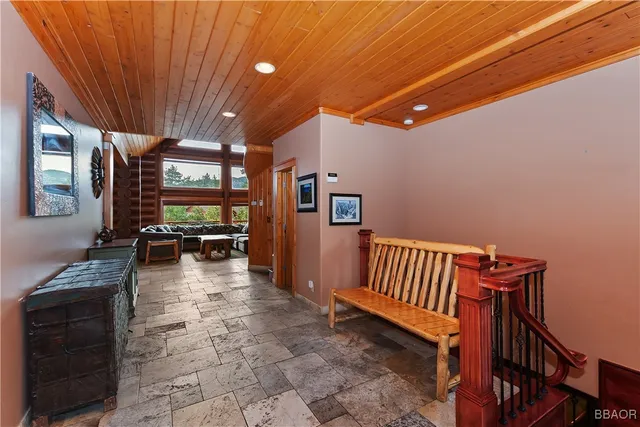 a lobby with furniture and a rug