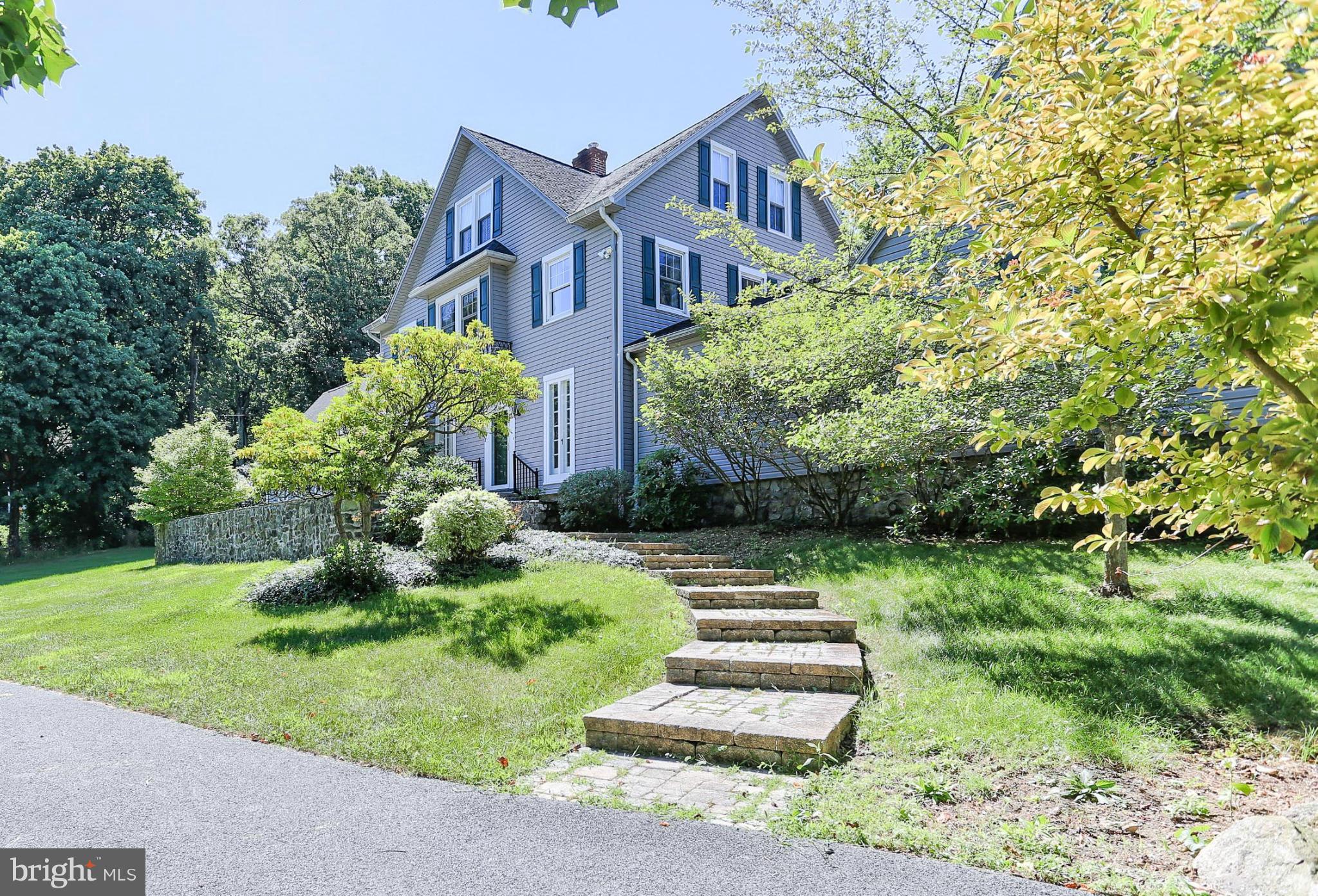 14611 Water Company Road Cascade, MD 21719 - Photo 2 of 30 a front view of a house with a yard and green space