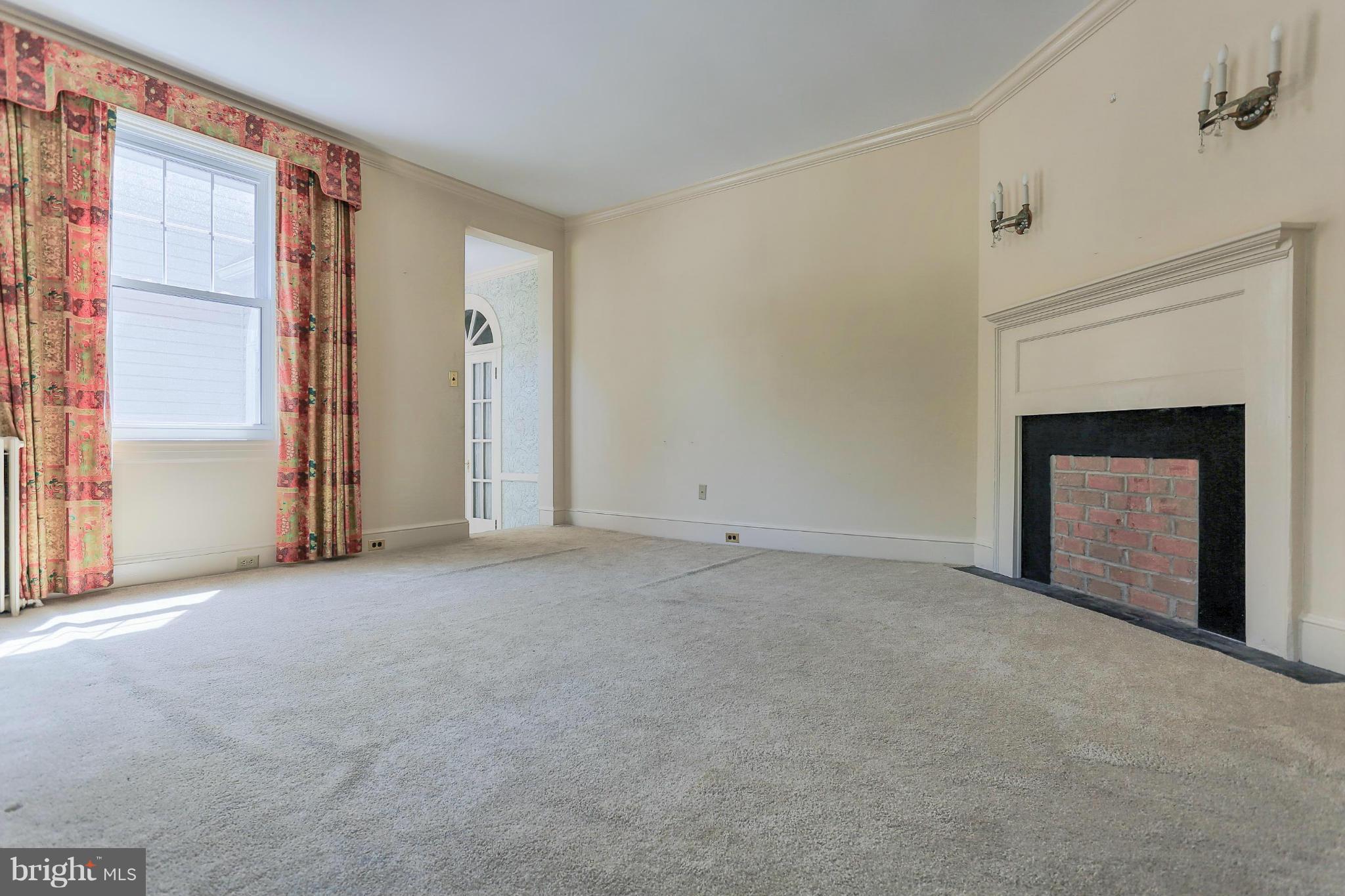 14611 Water Company Road Cascade, MD 21719 - Photo 14 of 30 an empty room with windows and fireplace