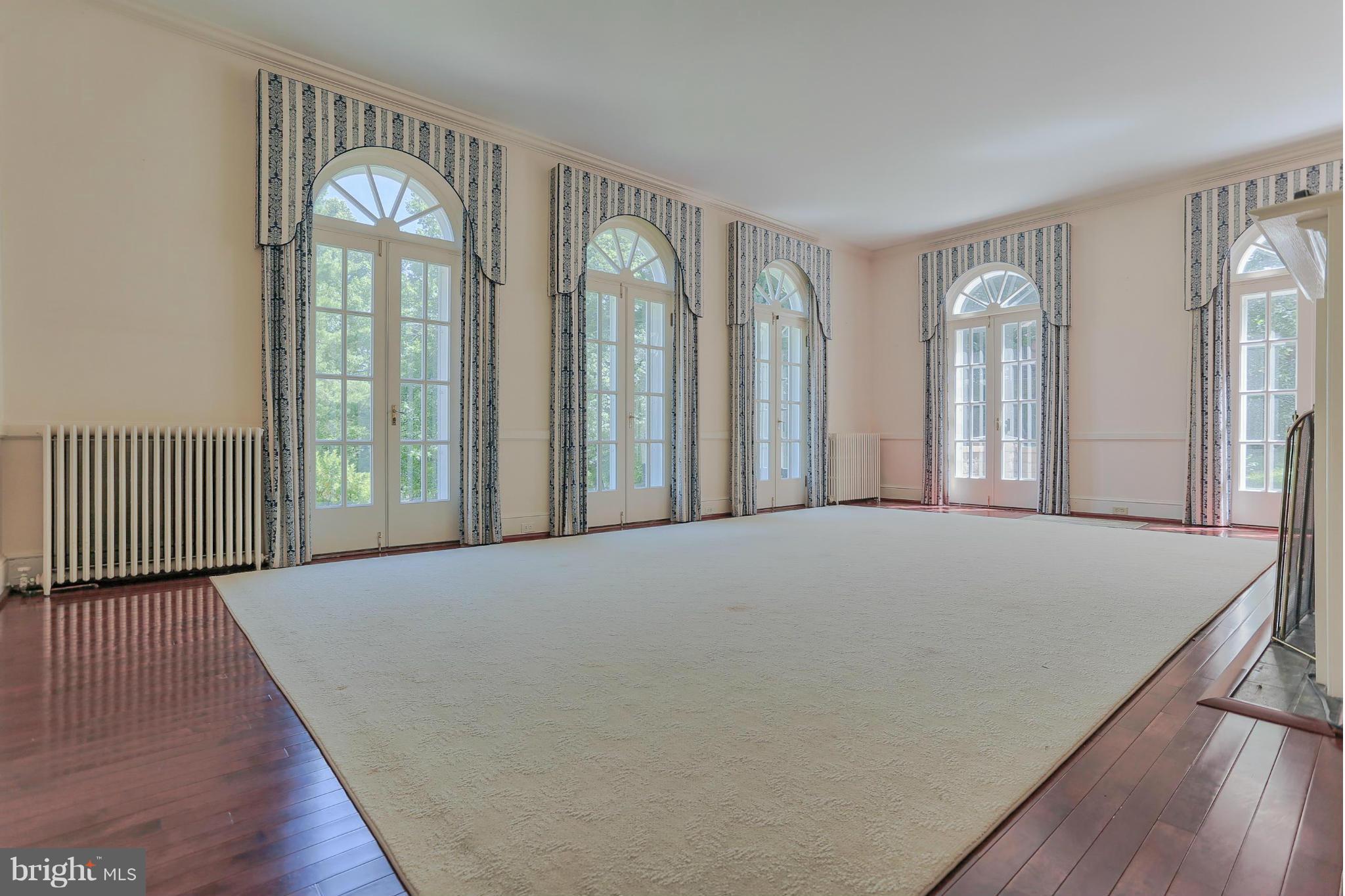 14611 Water Company Road Cascade, MD 21719 - Photo 17 of 30 a view of an empty room with glass door