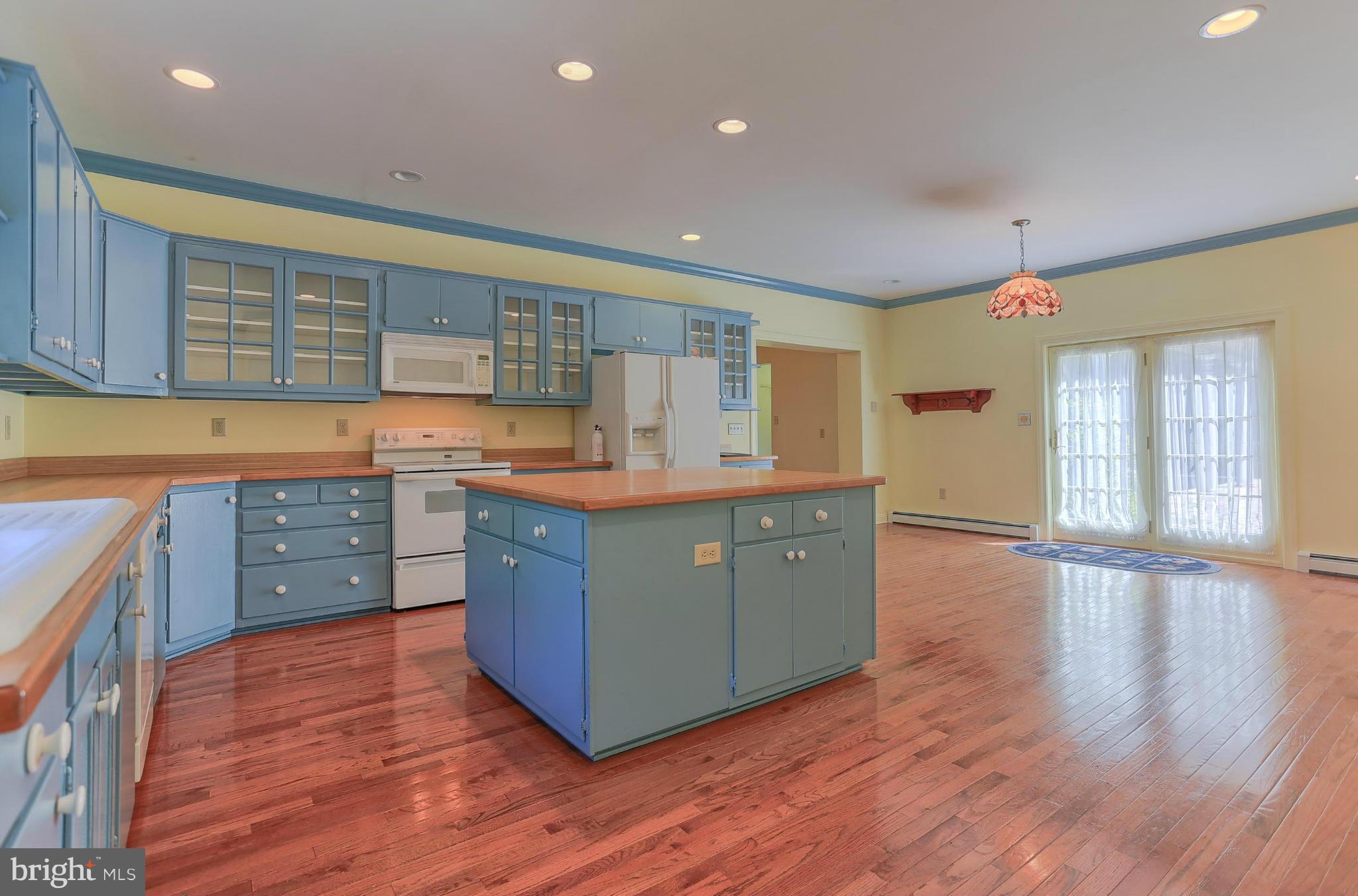 14611 Water Company Road Cascade, MD 21719 - Photo 21 of 30 a kitchen with stainless steel appliances granite countertop a sink and wooden floors