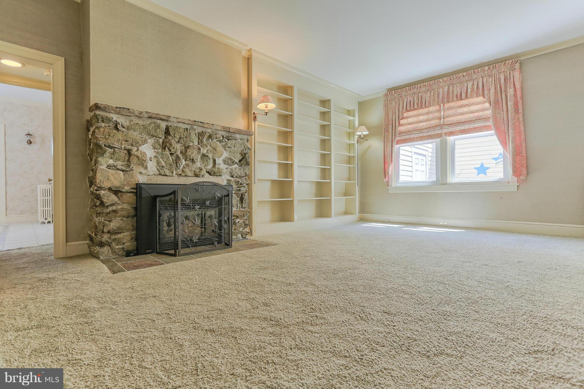 14611 Water Company Road Cascade, MD 21719 - Photo 23 of 30 an empty room with windows and fireplace