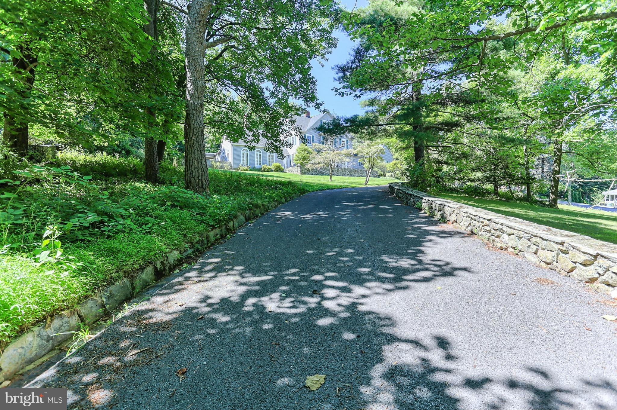 14611 Water Company Road Cascade, MD 21719 - Photo 6 of 30 a view of a street with a yard and trees