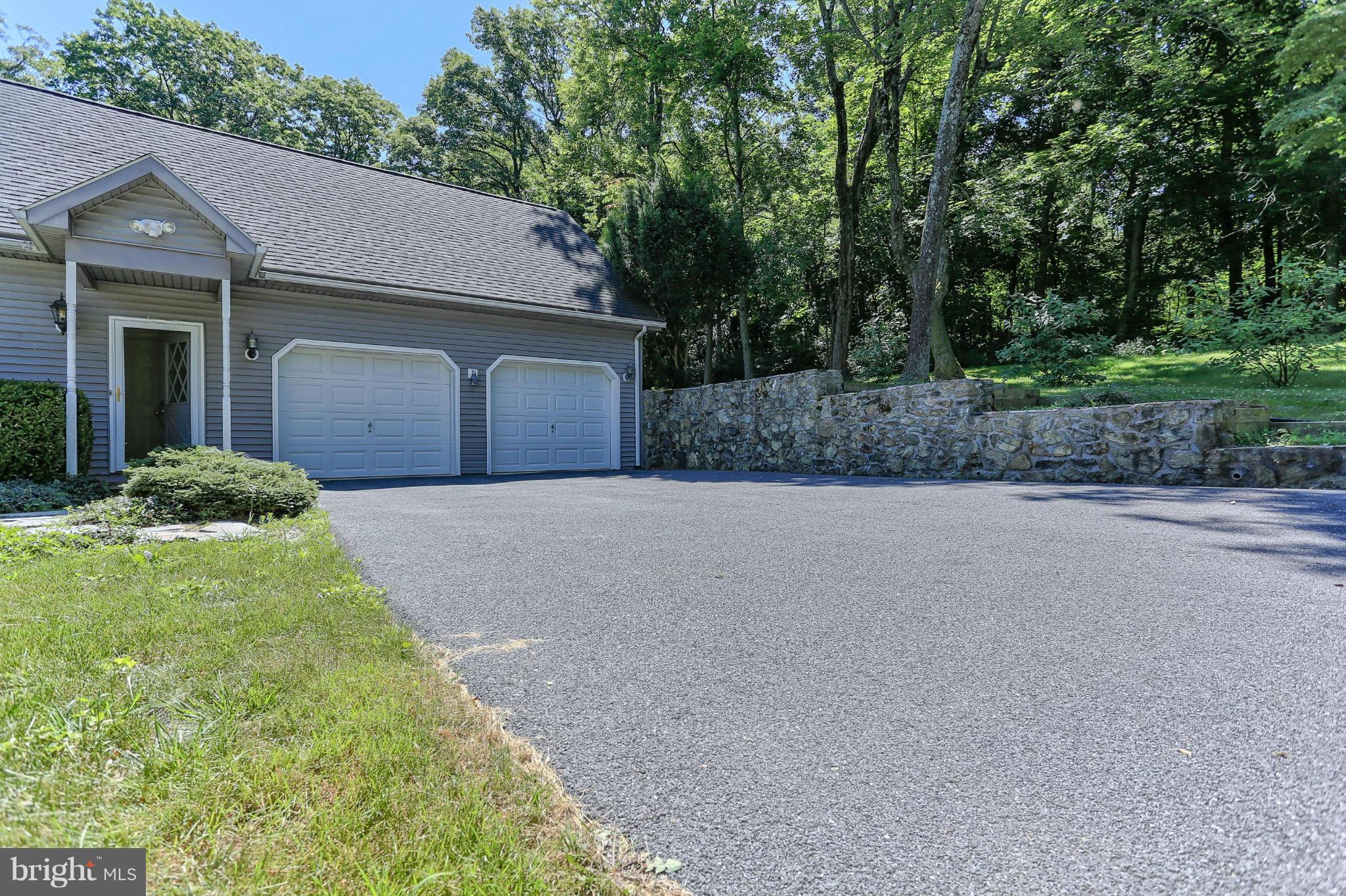 14611 Water Company Road Cascade, MD 21719 - Photo 8 of 30 a front view of a house with a yard and trees