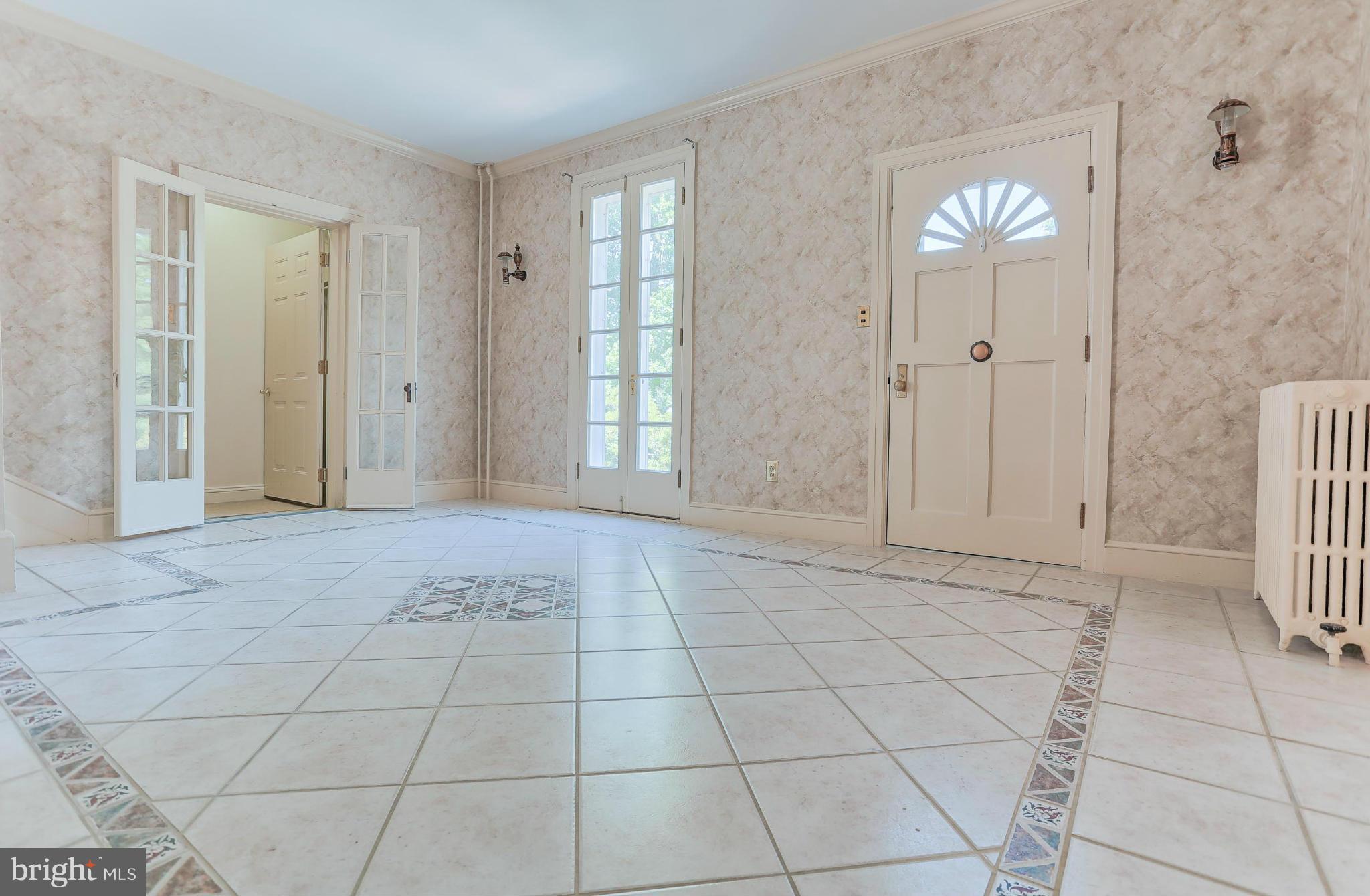 14611 Water Company Road Cascade, MD 21719 - Photo 10 of 30 a view of an empty room with window and chandelier