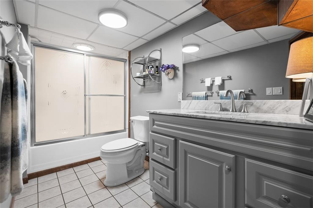 5517 Gibson Road Gibsonia, PA 15044 - Photo 22 of 43 a bathroom with a granite countertop sink toilet and shower