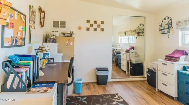 a view of a kitchen with fridge and workspace
